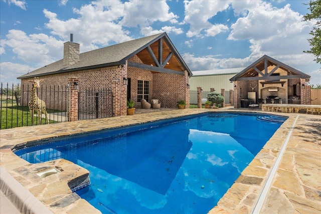 view of swimming pool featuring a patio