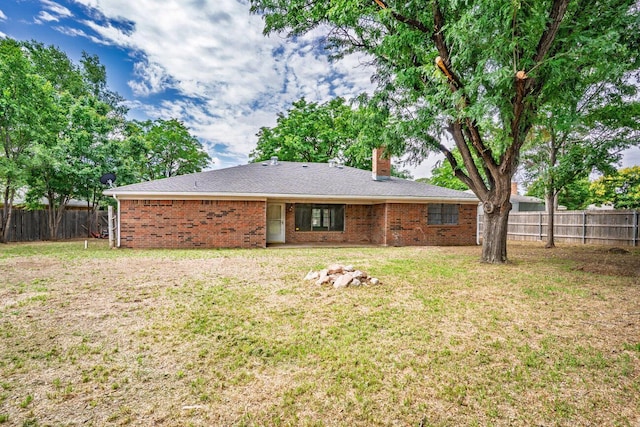 5003 Greenway Pl, Amarillo, TX 79109 - back of house with a chimney and brick siding