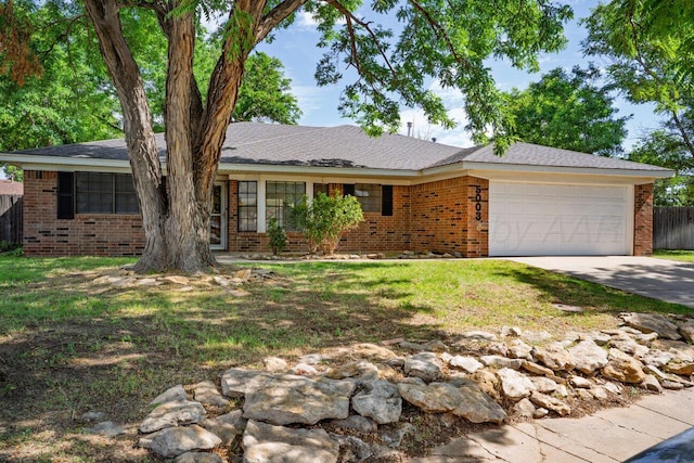 5003 Greenway Pl, Amarillo, TX 79109 - ranch-style house with a garage, brick siding, and driveway