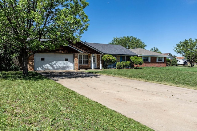 ranch-style house featuring an attached garage, driveway, a front lawn, and brick siding