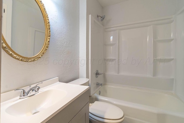 bathroom featuring a textured wall, toilet, shower / bath combination, and vanity