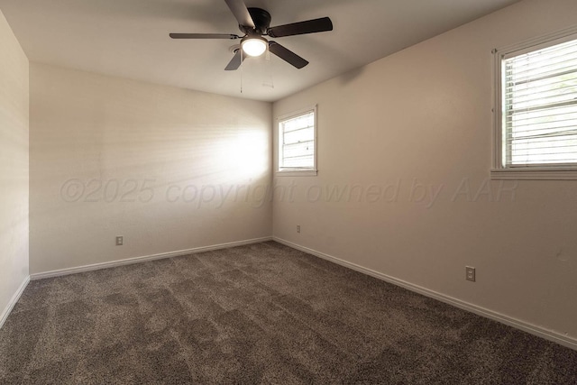 unfurnished room featuring dark colored carpet, a ceiling fan, and baseboards