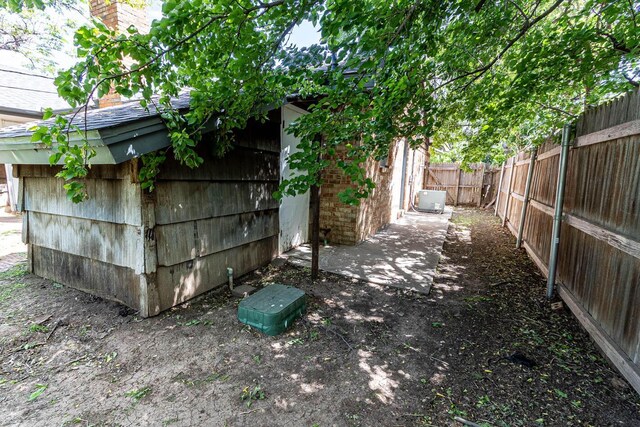 view of outdoor structure with a fenced backyard