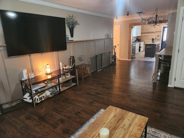 3114 Palm St, Amarillo, TX 79107 - living room with crown molding, dark wood-style floors, and a chandelier