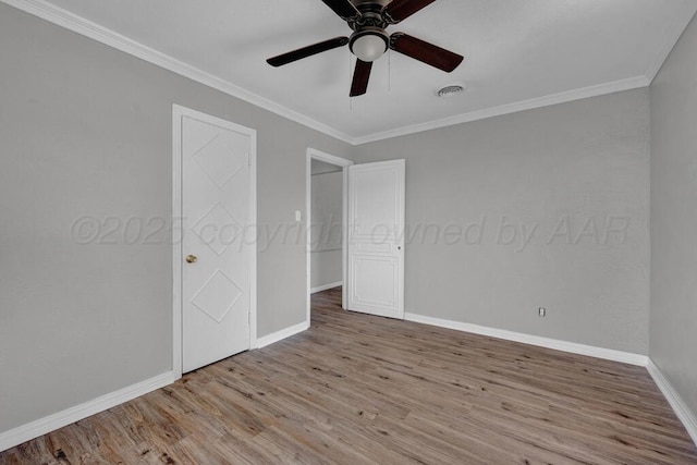 4360 S Polk St, Amarillo, TX 79110 - unfurnished bedroom featuring wood finished floors, crown molding, and a ceiling fan