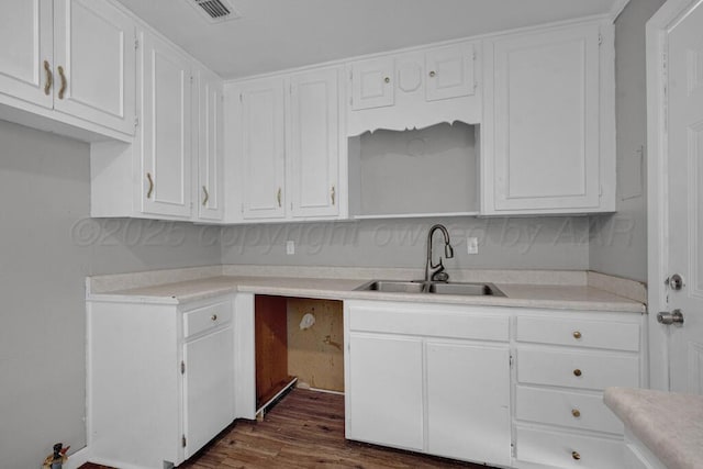 4360 S Polk St, Amarillo, TX 79110 - kitchen with white cabinetry, dark wood-style flooring, and light countertops