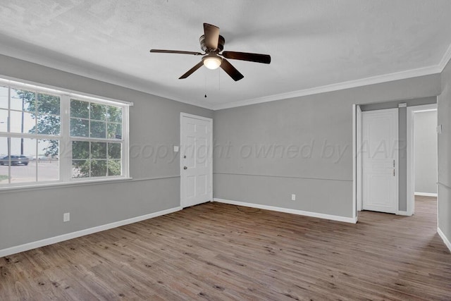 4360 S Polk St, Amarillo, TX 79110 - spare room featuring wood finished floors, a ceiling fan, and ornamental molding