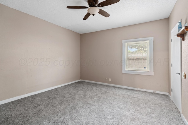 carpeted empty room featuring a textured ceiling, ceiling fan, and baseboards