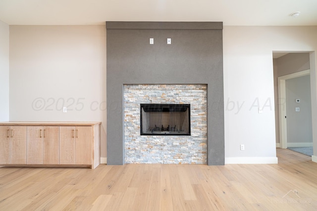 1207 Herring Ranch Rd, Amarillo, TX 79124 - unfurnished living room featuring wood finished floors and a stone fireplace