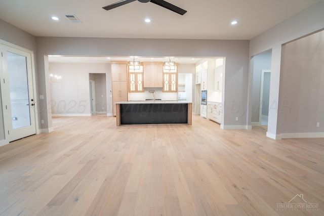 1207 Herring Ranch Rd, Amarillo, TX 79124 - unfurnished living room with light wood-style floors, ceiling fan, and recessed lighting