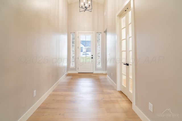 1207 Herring Ranch Rd, Amarillo, TX 79124 - foyer featuring a chandelier, light wood finished floors, and a high ceiling