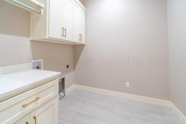 1207 Herring Ranch Rd, Amarillo, TX 79124 - washroom with hookup for an electric dryer, washer hookup, and cabinet space