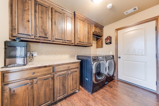 12 William Ln, Canyon, TX 79015 - laundry room with cabinet space, independent washer and dryer, and light wood-type flooring
