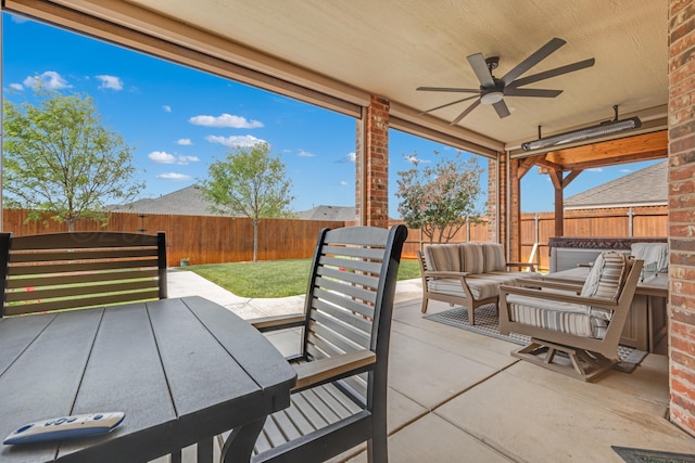 12 William Ln, Canyon, TX 79015 - fenced backyard with ceiling fan, an outdoor hangout area, and a patio area