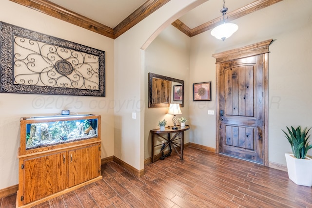 12 William Ln, Canyon, TX 79015 - foyer entrance featuring ornamental molding, arched walkways, and dark wood-style floors