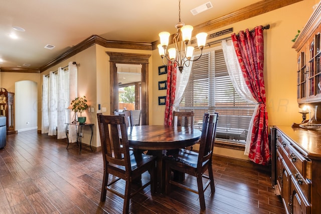 12 William Ln, Canyon, TX 79015 - dining space with a chandelier, arched walkways, dark wood-style floors, and crown molding