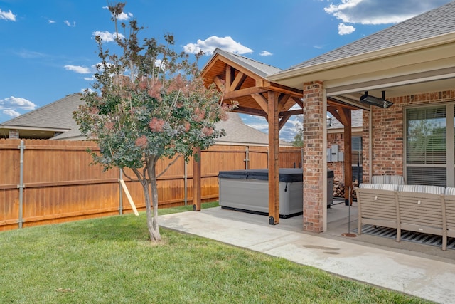 12 William Ln, Canyon, TX 79015 - fenced backyard featuring a hot tub and a patio area