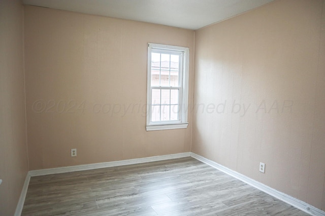 spare room with light hardwood / wood-style floors