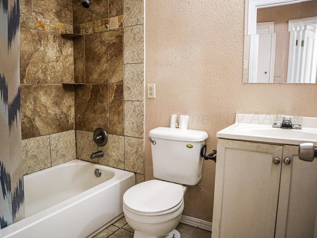 full bathroom with tile patterned floors, vanity, toilet, and tiled shower / bath combo