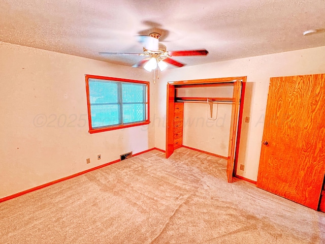 1301 S Fordham St, Perryton, TX 79070 - unfurnished bedroom with carpet floors, a textured ceiling, a closet, and ceiling fan