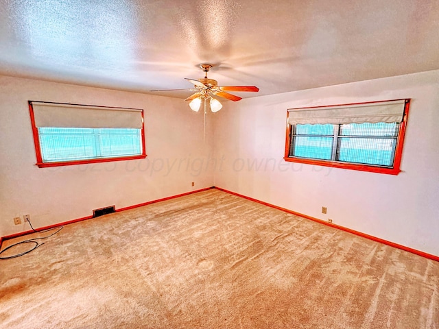 1301 S Fordham St, Perryton, TX 79070 - carpeted empty room with ceiling fan and a textured ceiling