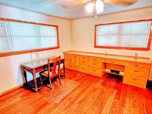 1301 S Fordham St, Perryton, TX 79070 - office area featuring light wood-style flooring, a ceiling fan, and built in study area