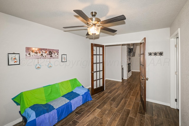 3001 Bismarck Ave, Amarillo, TX 79118 - hall with dark wood-style flooring, baseboards, a textured ceiling, and french doors