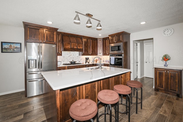 3001 Bismarck Ave, Amarillo, TX 79118 - kitchen with appliances with stainless steel finishes, custom exhaust hood, a sink, baseboards, and light countertops