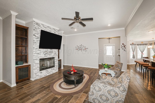 3001 Bismarck Ave, Amarillo, TX 79118 - living area featuring dark wood-type flooring, ceiling fan, baseboards, a fireplace, and a textured ceiling