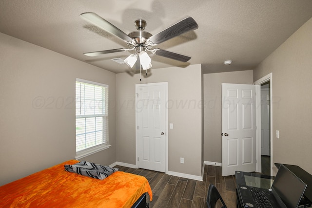 3001 Bismarck Ave, Amarillo, TX 79118 - bedroom with wood tiled floors, baseboards, a textured ceiling, and a ceiling fan