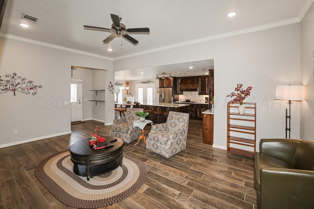 3001 Bismarck Ave, Amarillo, TX 79118 - living room with dark wood finished floors, a ceiling fan, baseboards, ornamental molding, and recessed lighting
