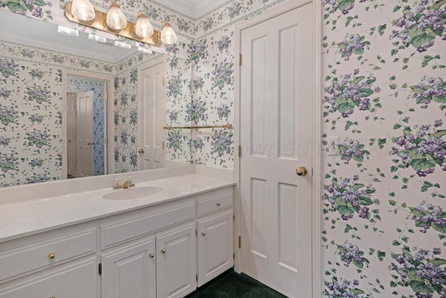 2614 Parker St, Amarillo, TX 79109 - bathroom with wallpapered walls, vanity, and ornamental molding
