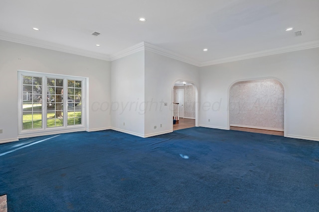 2614 Parker St, Amarillo, TX 79109 - carpeted empty room featuring baseboards, recessed lighting, ornamental molding, and arched walkways