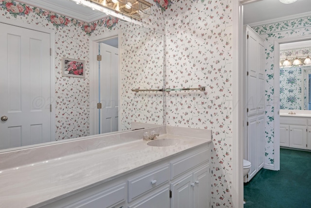 2614 Parker St, Amarillo, TX 79109 - bathroom featuring wallpapered walls, vanity, toilet, and crown molding