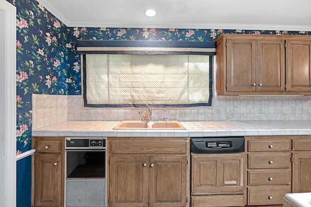 2614 Parker St, Amarillo, TX 79109 - kitchen with wallpapered walls, a sink, decorative backsplash, brown cabinets, and ornamental molding