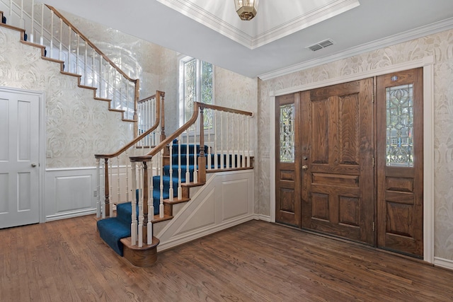 2614 Parker St, Amarillo, TX 79109 - foyer entrance featuring wallpapered walls, stairway, wood finished floors, ornamental molding, and a wainscoted wall