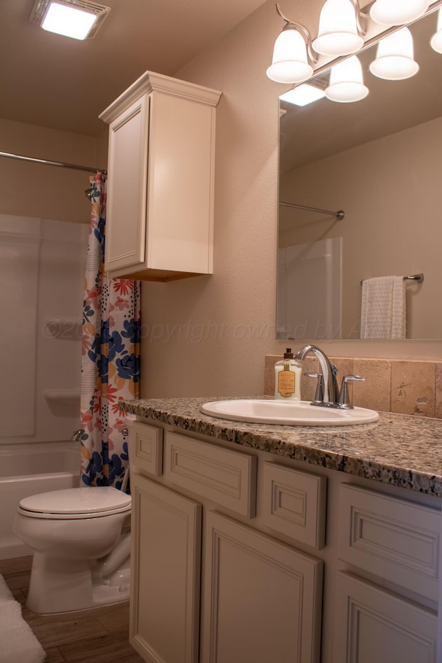 bathroom with toilet, shower / bathtub combination with curtain, wood finished floors, and vanity