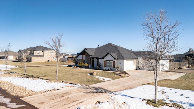 view of front of property with a lawn and a garage