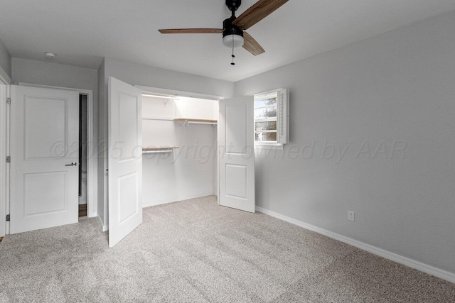 unfurnished bedroom with carpet, baseboards, a closet, and a ceiling fan