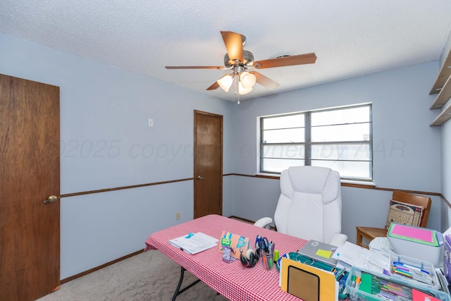 office space featuring ceiling fan, baseboards, and carpet flooring