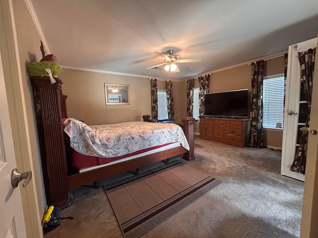 carpeted bedroom featuring a textured ceiling, ceiling fan, and crown molding