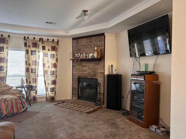 carpeted living room featuring a fireplace, crown molding, and a tray ceiling