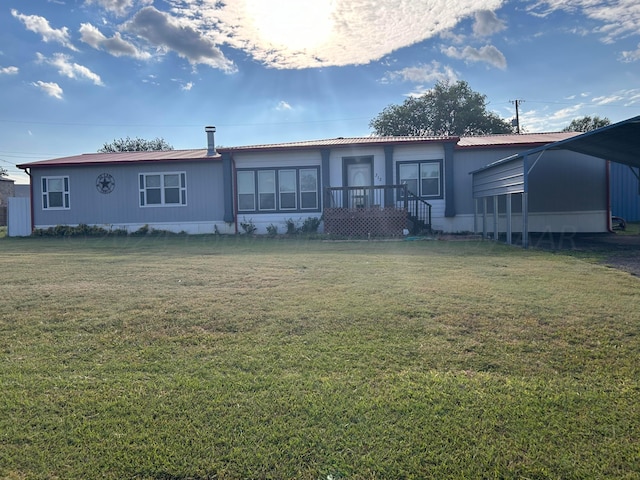 back of house with a lawn