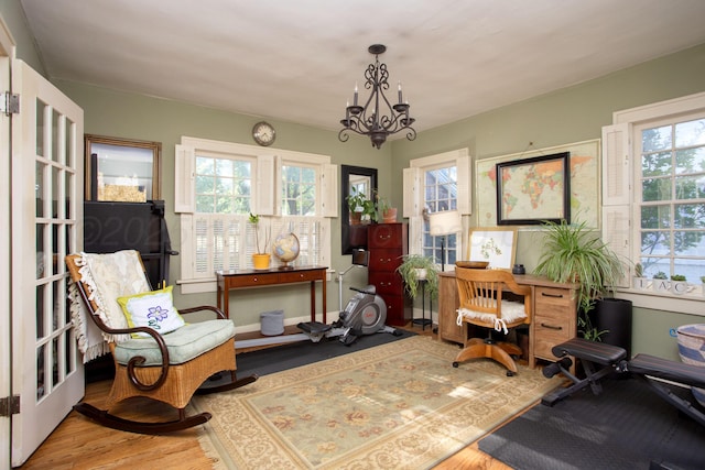 2402 S Ong St, Amarillo, TX 79109 - sitting room featuring wood finished floors and a chandelier