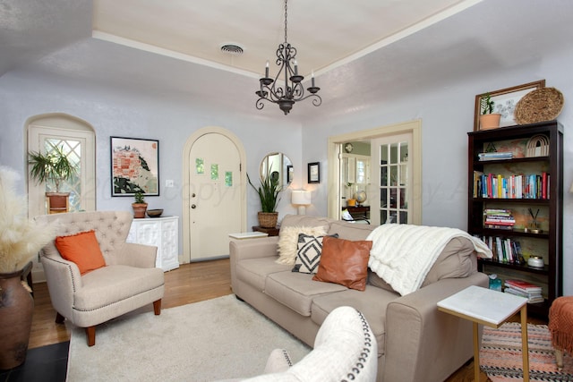 2402 S Ong St, Amarillo, TX 79109 - living area featuring a raised ceiling, a chandelier, and wood finished floors