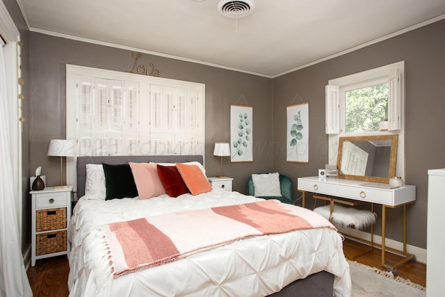 2402 S Ong St, Amarillo, TX 79109 - bedroom with wood finished floors and ornamental molding