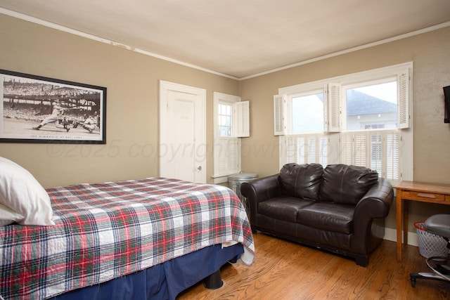 2402 S Ong St, Amarillo, TX 79109 - bedroom featuring wood finished floors and ornamental molding