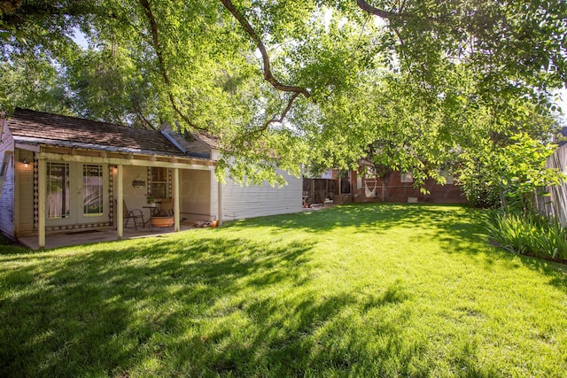 2402 S Ong St, Amarillo, TX 79109 - fenced backyard with a patio