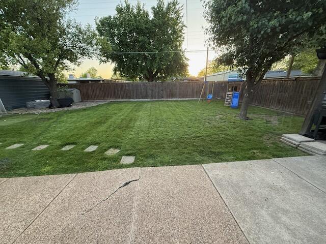 1607 N Mary-Ellen St, Pampa, TX 79065 - yard at dusk with a patio