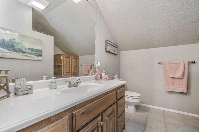 1607 N Mary-Ellen St, Pampa, TX 79065 - bathroom featuring toilet, lofted ceiling, vanity, a textured ceiling, and tile patterned flooring